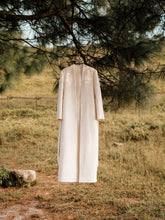 Textured wool long coat with tailored silhouette and open front design